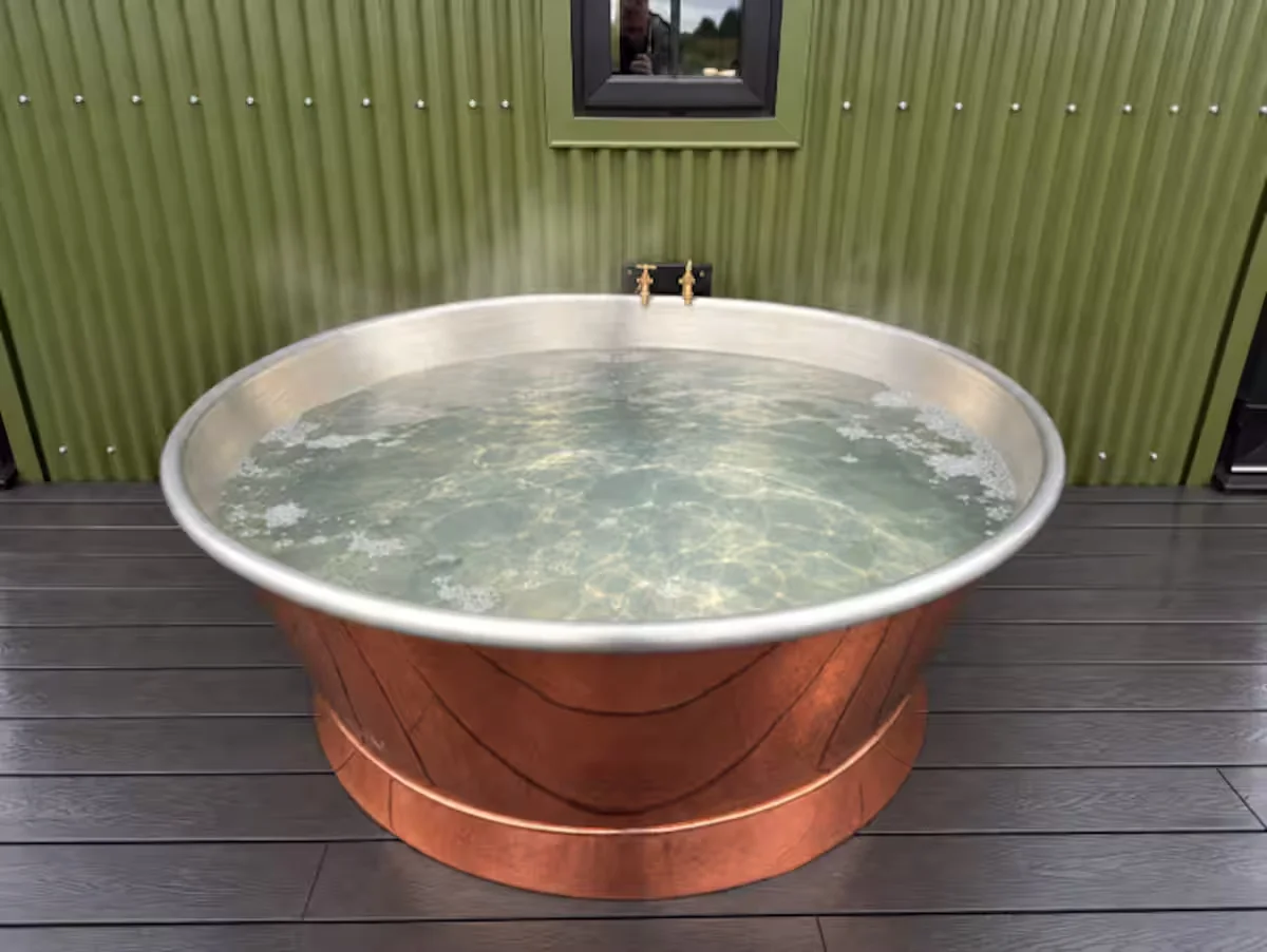 Water bubbling in Sloe's handcrafted copper spa bath on the private deck